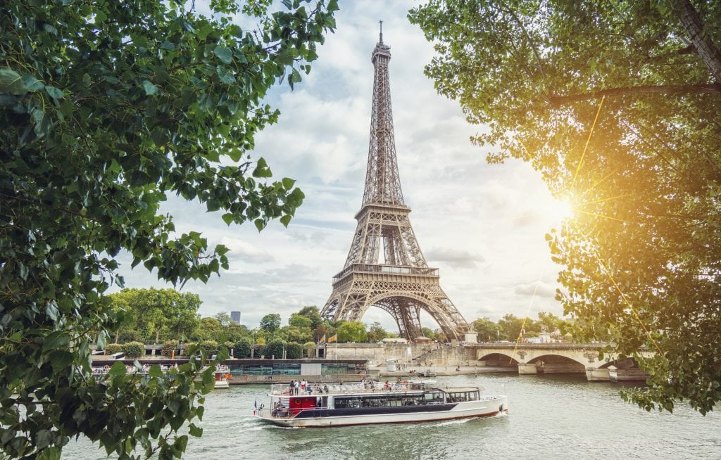 Paris Seine view with Eiffel tower and ship at summer