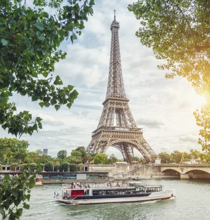 Paris Seine view with Eiffel tower and ship at summer
